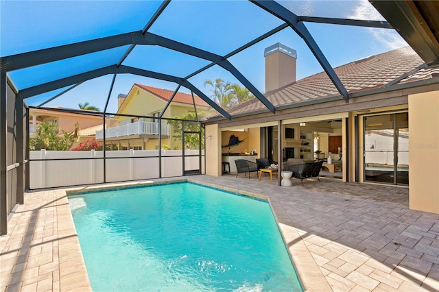 view of swimming pool with a patio area, a fenced in pool, and fence