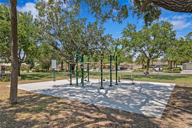 surrounding community with fence, playground community, and a lawn