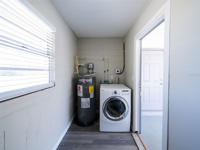 laundry room featuring laundry area, washer / clothes dryer, wood finished floors, and electric water heater