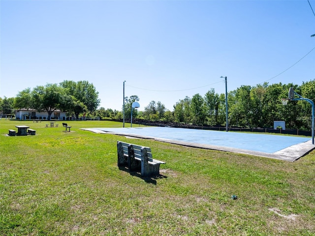 view of yard featuring community basketball court