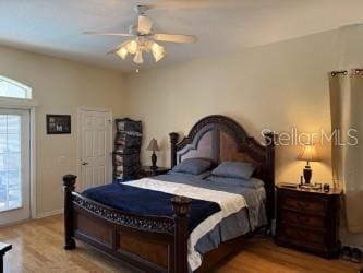 bedroom featuring a ceiling fan and wood finished floors