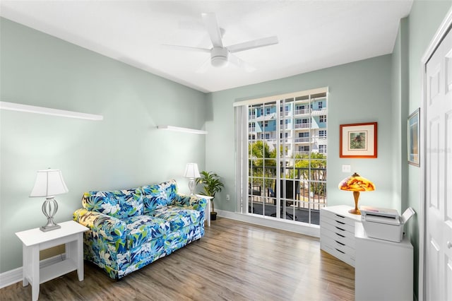 545 Bahia Beach Blvd, Ruskin, FL 33570 - sitting room with baseboards, wood finished floors, and a ceiling fan