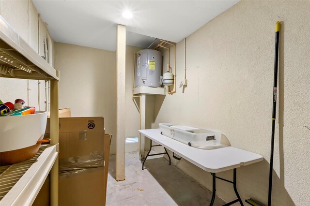 545 Bahia Beach Blvd, Ruskin, FL 33570 - basement featuring electric water heater and a textured wall