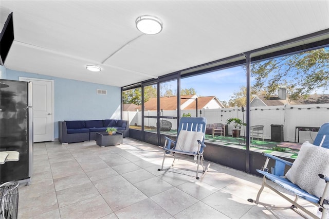 sunroom / solarium featuring visible vents