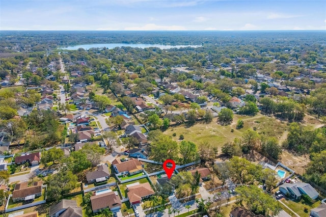 drone / aerial view with a residential view and a water view