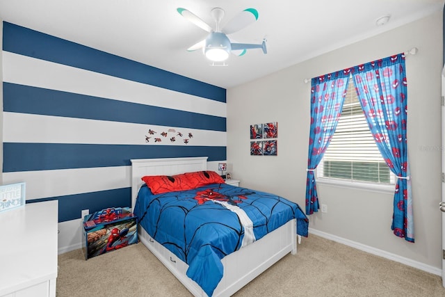 bedroom featuring baseboards, ceiling fan, and carpet flooring