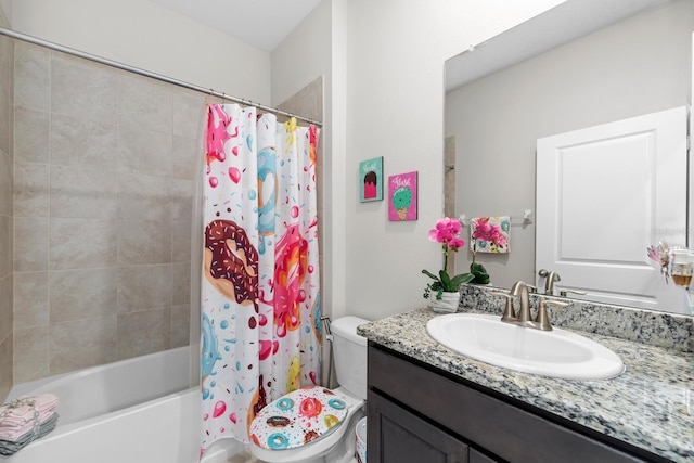 bathroom featuring vanity, shower / bath combination with curtain, and toilet