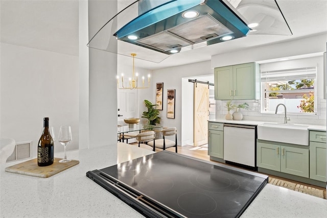 kitchen with green cabinetry, dishwasher, ventilation hood, and a sink