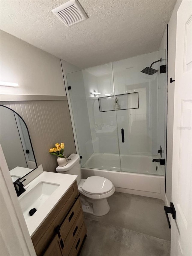 bathroom with visible vents, a textured ceiling, concrete floors, bathtub / shower combination, and vanity