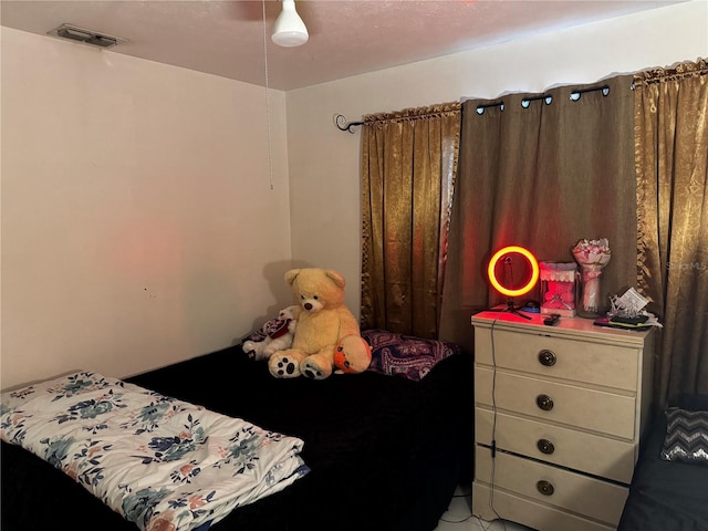 bedroom featuring visible vents