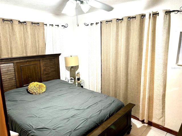 bedroom featuring light tile patterned floors and a ceiling fan