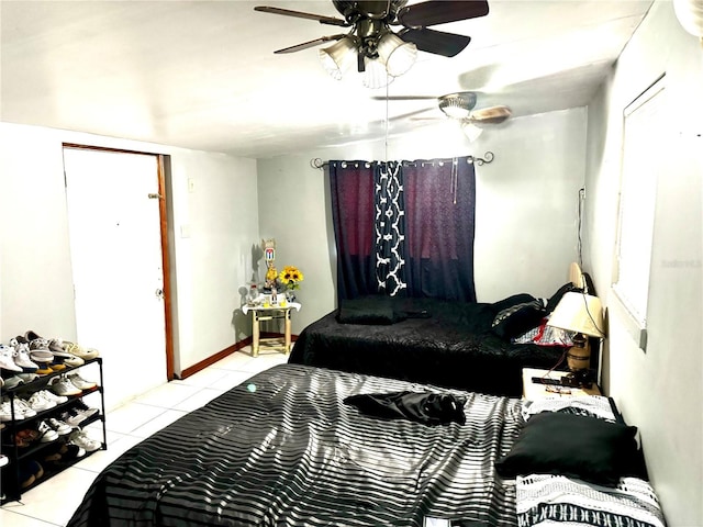 tiled bedroom with ceiling fan