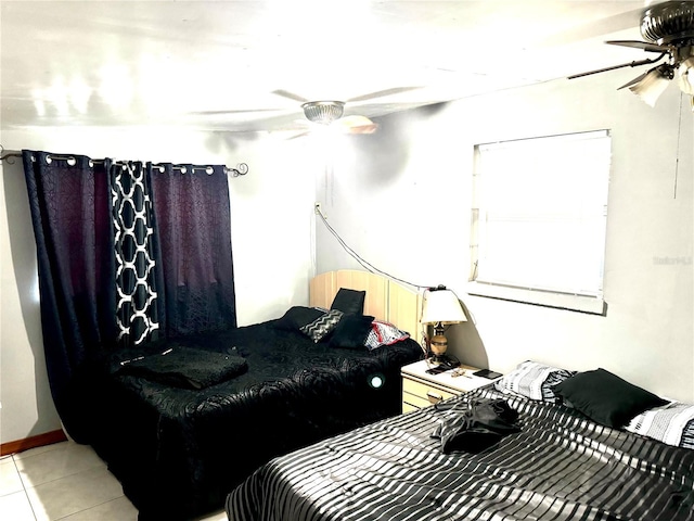 bedroom with light tile patterned flooring and a ceiling fan