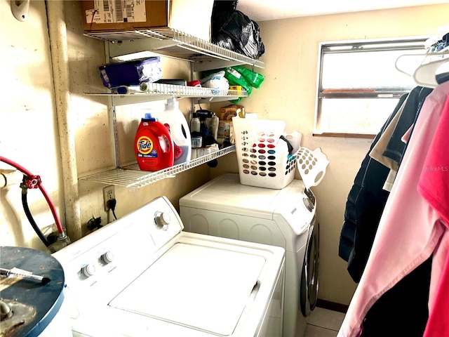 laundry area featuring washer and clothes dryer and laundry area