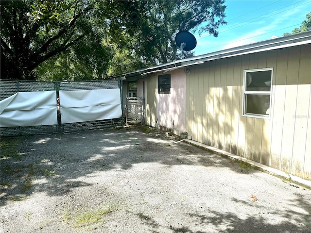 view of home's exterior with fence