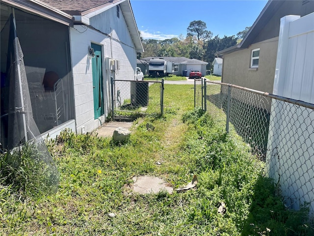 view of yard with cooling unit and fence