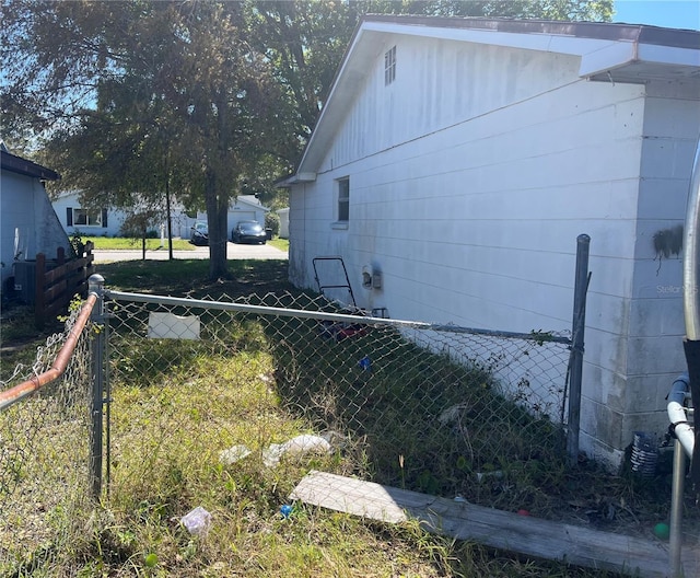 view of home's exterior with fence