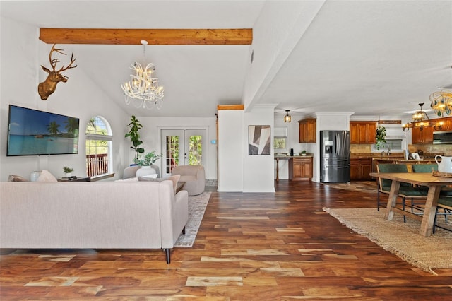 living area featuring dark wood-type flooring, beamed ceiling, french doors, an inviting chandelier, and high vaulted ceiling