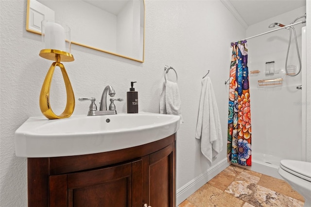 bathroom with vanity, toilet, stone tile floors, and a shower stall