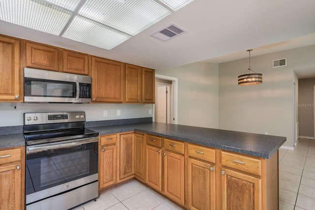 kitchen featuring light tile patterned floors, visible vents, appliances with stainless steel finishes, and a peninsula