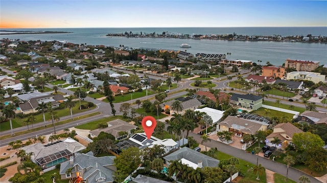 bird's eye view featuring a water view and a residential view