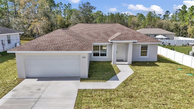 ranch-style house with a front yard, fence, driveway, and stucco siding