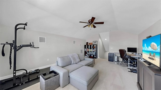 home office featuring a ceiling fan, visible vents, baseboards, vaulted ceiling, and light colored carpet