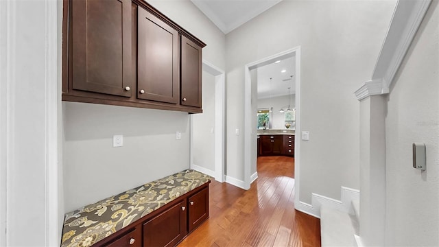 interior space with baseboards and wood finished floors