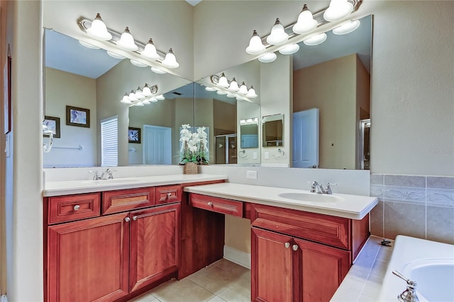 full bath featuring tile patterned flooring, a garden tub, vanity, and a stall shower