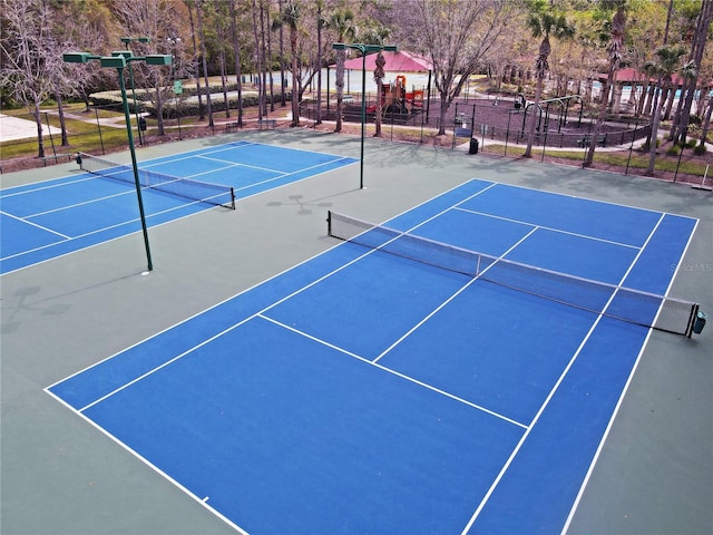 view of sport court with community basketball court and fence