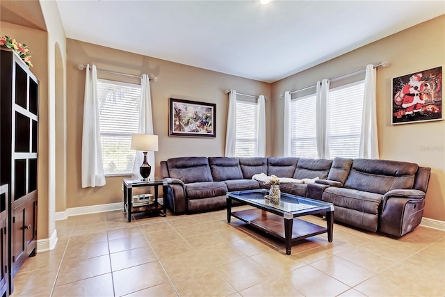 living room with light tile patterned floors and baseboards