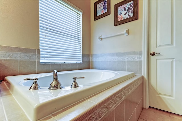 full bath featuring tile patterned flooring and a garden tub