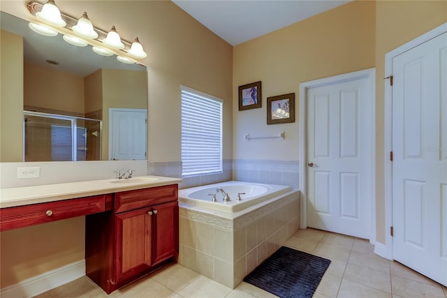 full bathroom with tile patterned floors, a stall shower, a bath, and vanity