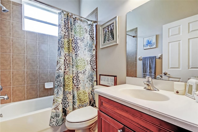 bathroom with vanity, toilet, and shower / bath combo