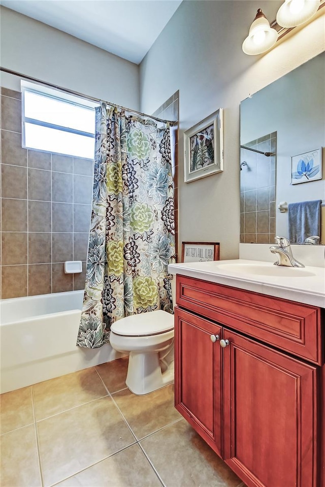 full bathroom featuring vanity, tile patterned floors, toilet, and shower / bath combo