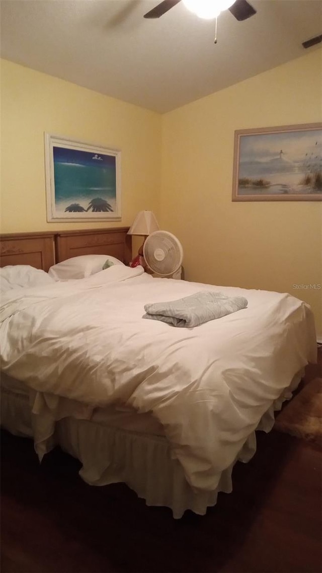 bedroom featuring lofted ceiling, a ceiling fan, and visible vents