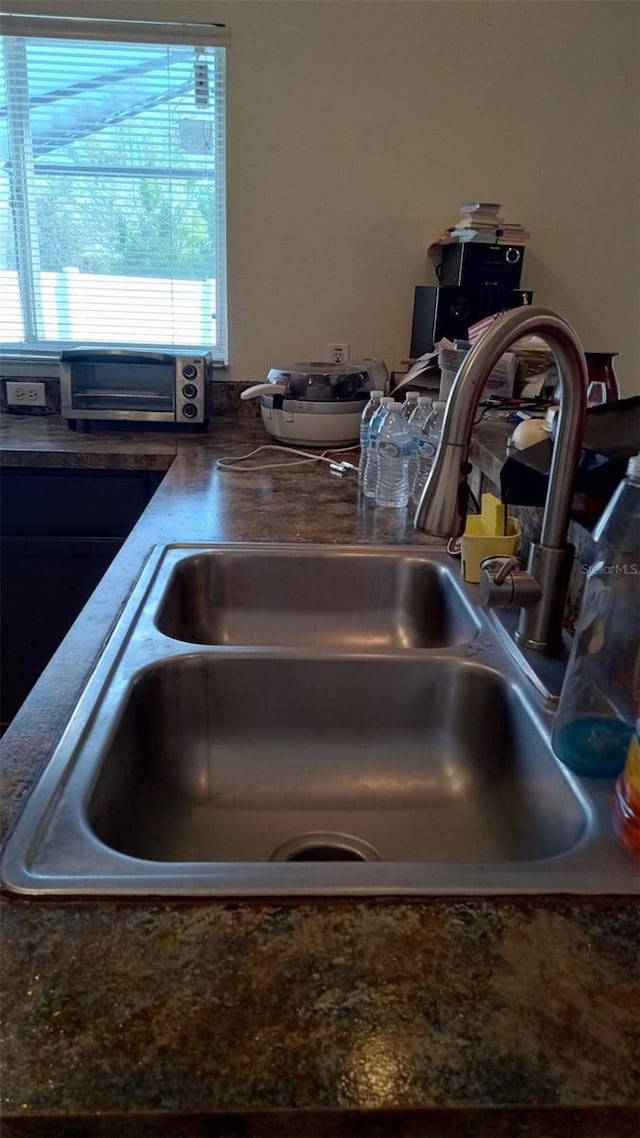 room details featuring a toaster and a sink