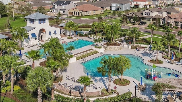 birds eye view of property with a residential view