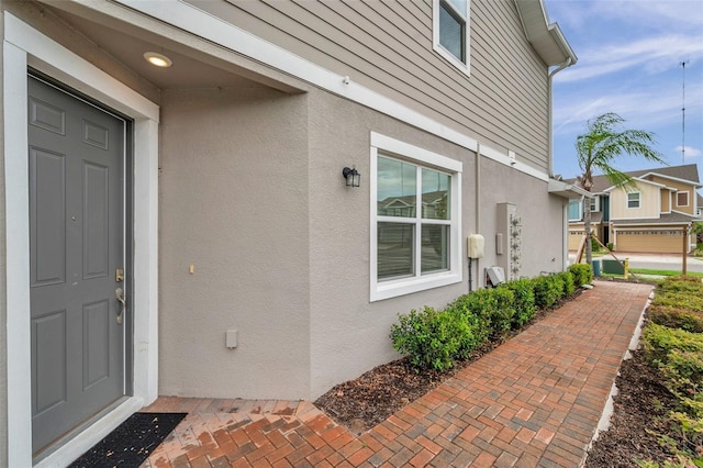 5728 Skytop Dr, Lithia, FL 33547 - property entrance with stucco siding