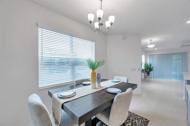 5728 Skytop Dr, Lithia, FL 33547 - dining space featuring a chandelier, baseboards, and light tile patterned floors