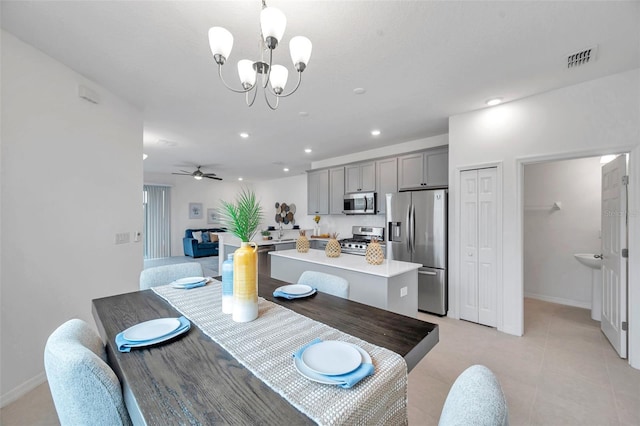5728 Skytop Dr, Lithia, FL 33547 - dining area featuring a chandelier, recessed lighting, baseboards, light tile patterned flooring, and a ceiling fan