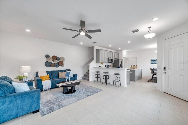 5728 Skytop Dr, Lithia, FL 33547 - living room featuring stairs, recessed lighting, ceiling fan, and light tile patterned floors
