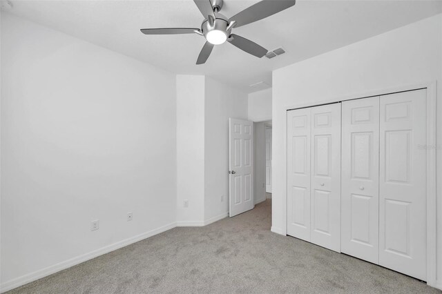 5728 Skytop Dr, Lithia, FL 33547 - unfurnished bedroom featuring carpet flooring, baseboards, a closet, and ceiling fan