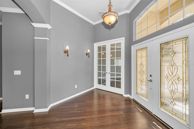 foyer entrance with french doors, baseboards, dark wood finished floors, and crown molding