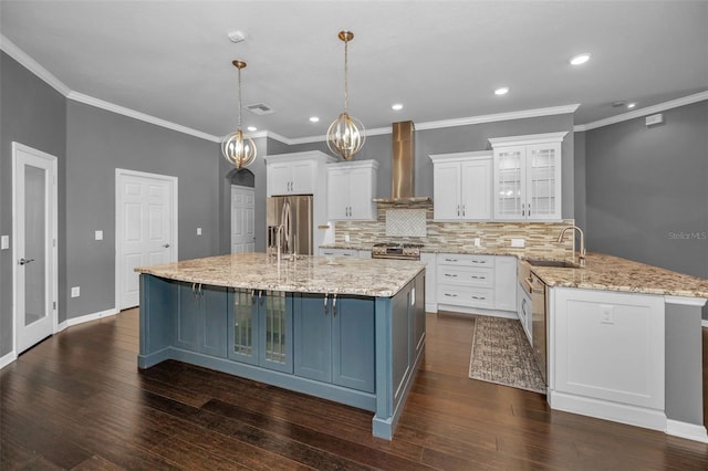 kitchen with stainless steel appliances, dark wood-type flooring, wall chimney exhaust hood, and white cabinets