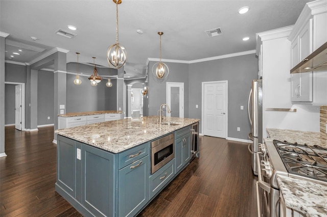 kitchen with white cabinetry, visible vents, appliances with stainless steel finishes, and a spacious island