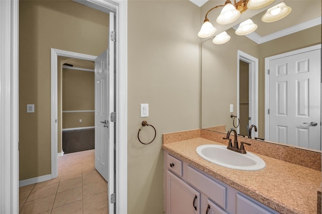 bathroom with tile patterned floors, baseboards, vanity, and crown molding