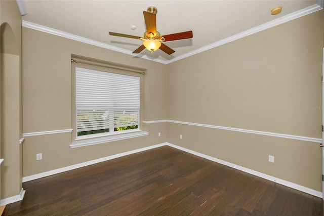 spare room featuring ornamental molding, ceiling fan, baseboards, and wood finished floors