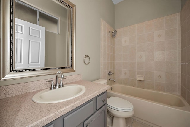 bathroom with tile patterned flooring, toilet, vanity, and  shower combination