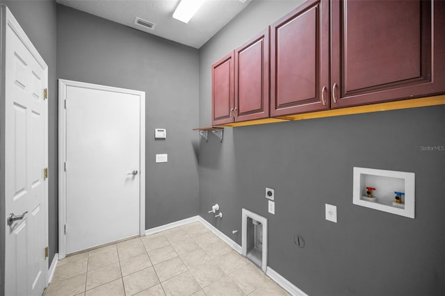 laundry area featuring hookup for a washing machine, visible vents, hookup for an electric dryer, gas dryer hookup, and cabinet space